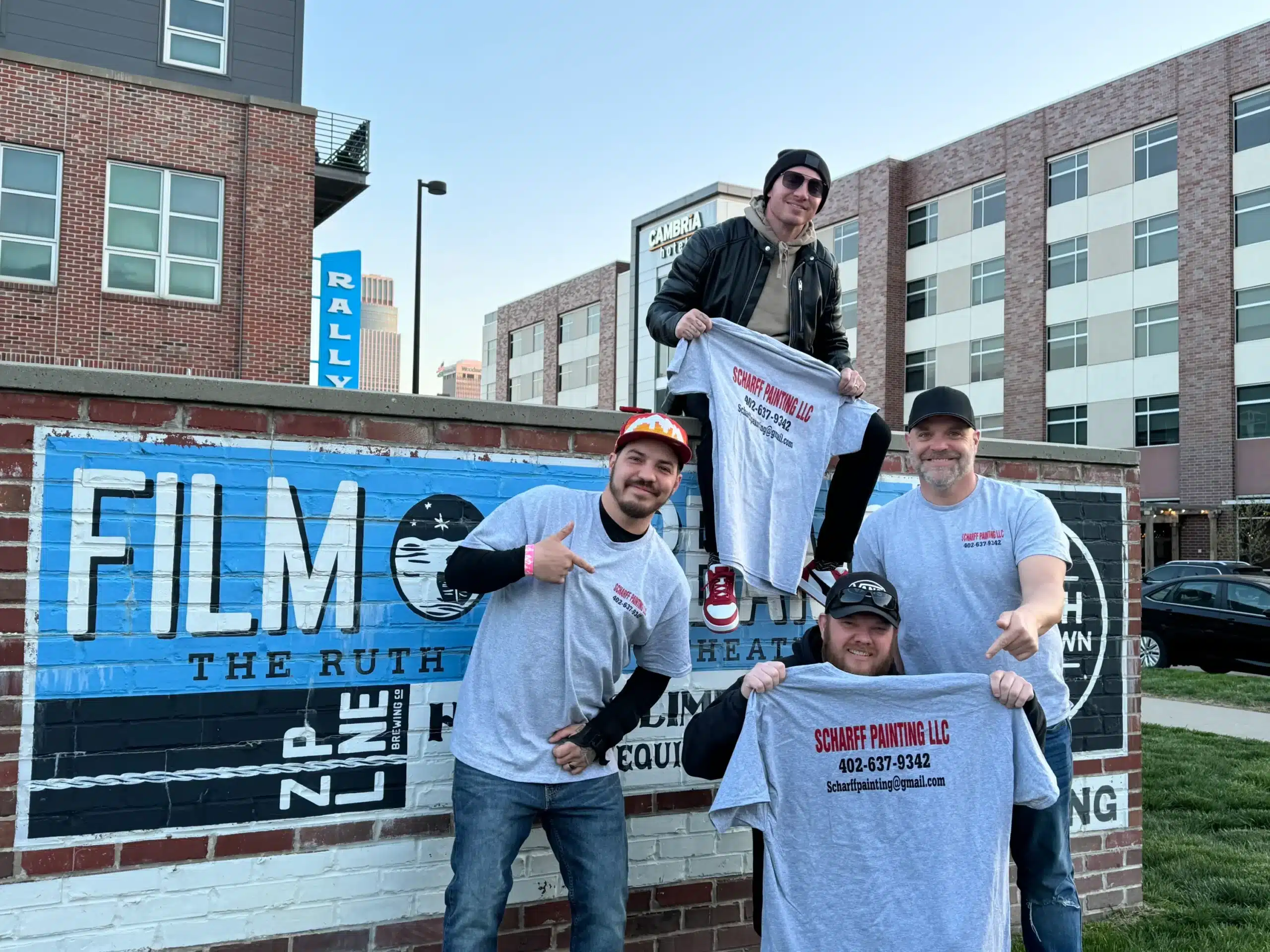 Endorsement photo of community influencer and Scharff Painting team at a local gathering