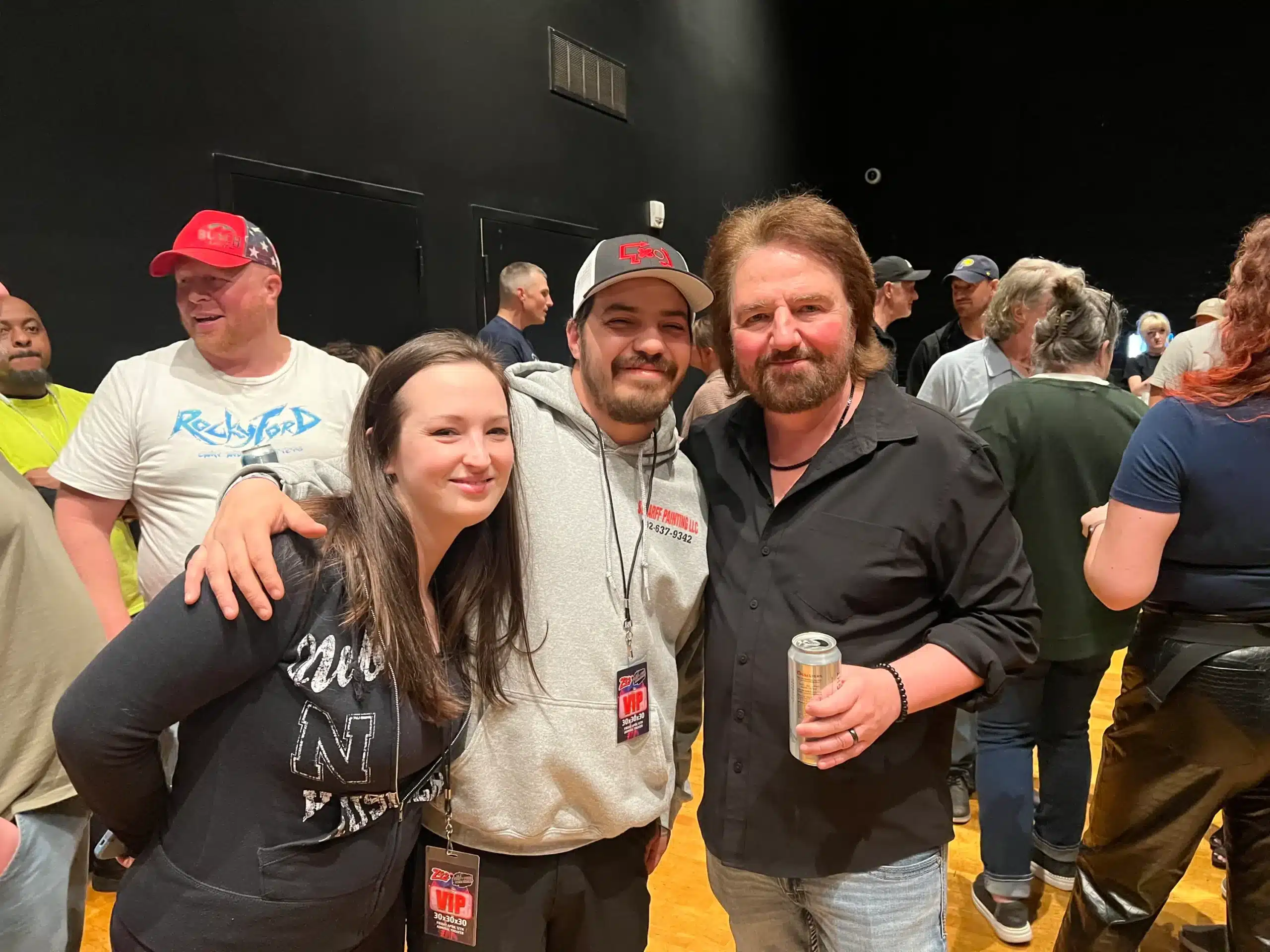 Endorsement photo of community influencer and Scharff Painting team at a local gathering